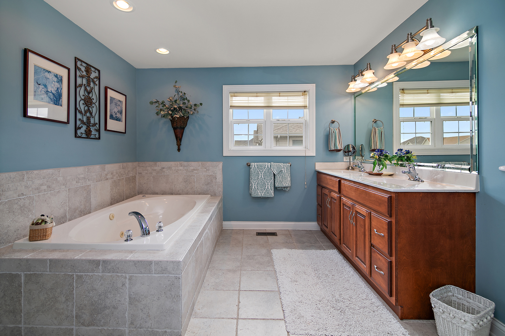 318 Maple Street Beecher, IL 60401 - Photo 17 of 27 a bathroom with a tub sink and mirror