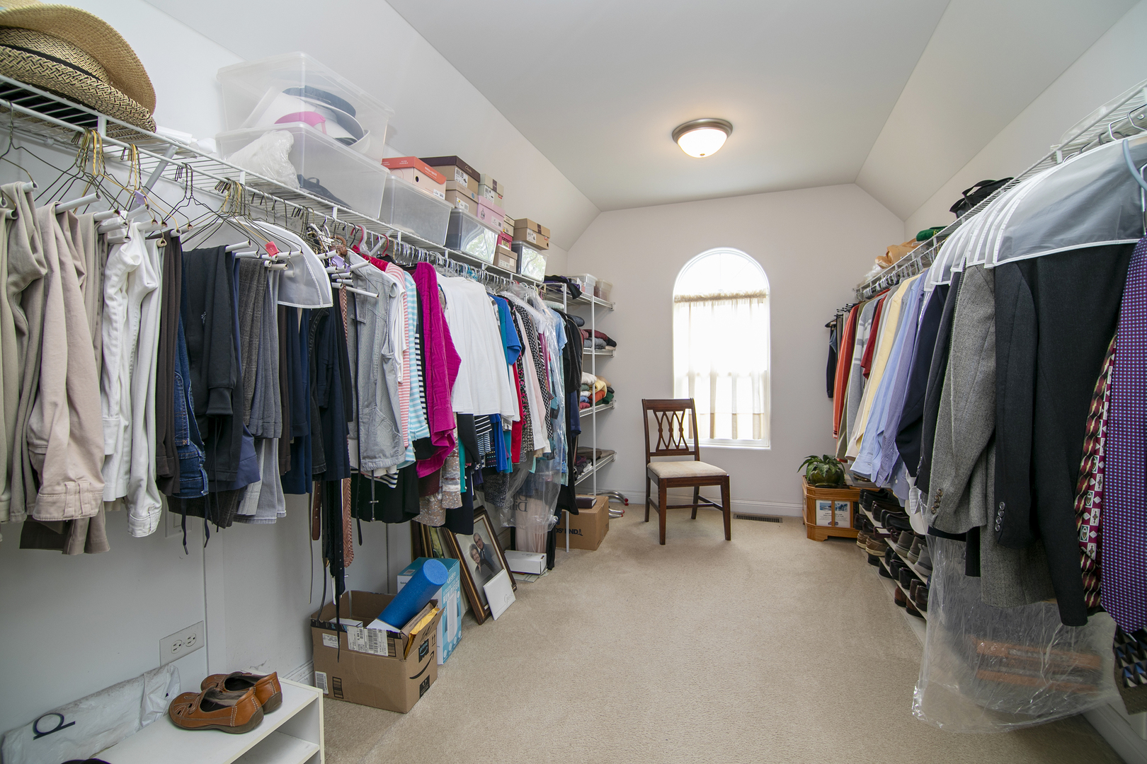 318 Maple Street Beecher, IL 60401 - Photo 19 of 27 a view of walk in closet with clothes and shoes