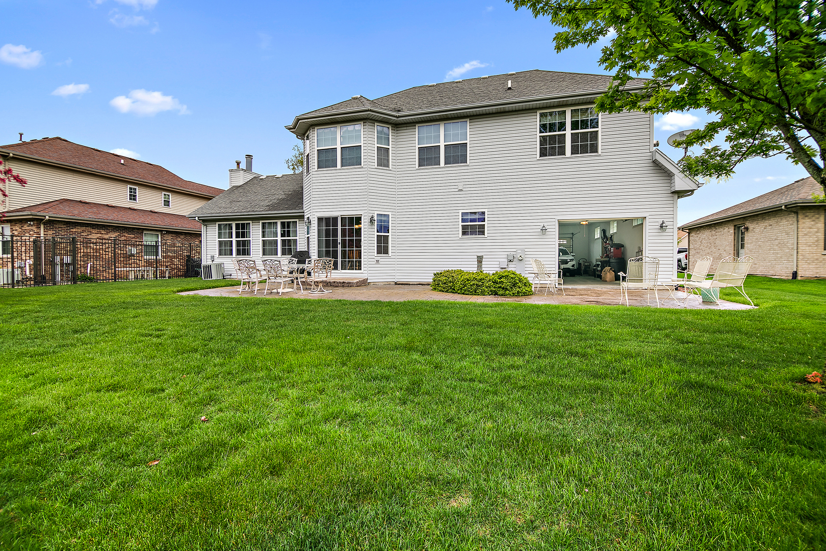 318 Maple Street Beecher, IL 60401 - Photo 24 of 27 a front view of a house with a yard and trees