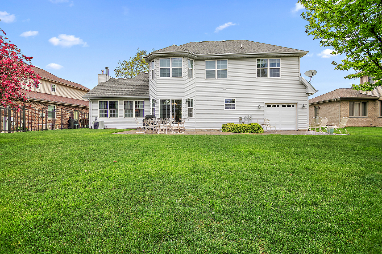 318 Maple Street Beecher, IL 60401 - Photo 26 of 27 a front view of a house with a yard and trees