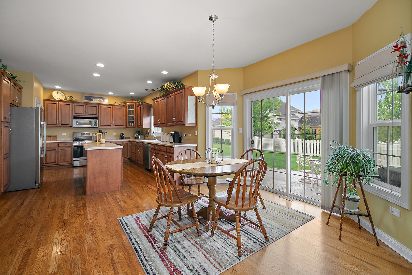 318 Maple Street Beecher, IL 60401 - Photo 5 of 27 a view of a dining room with furniture window and wooden floor