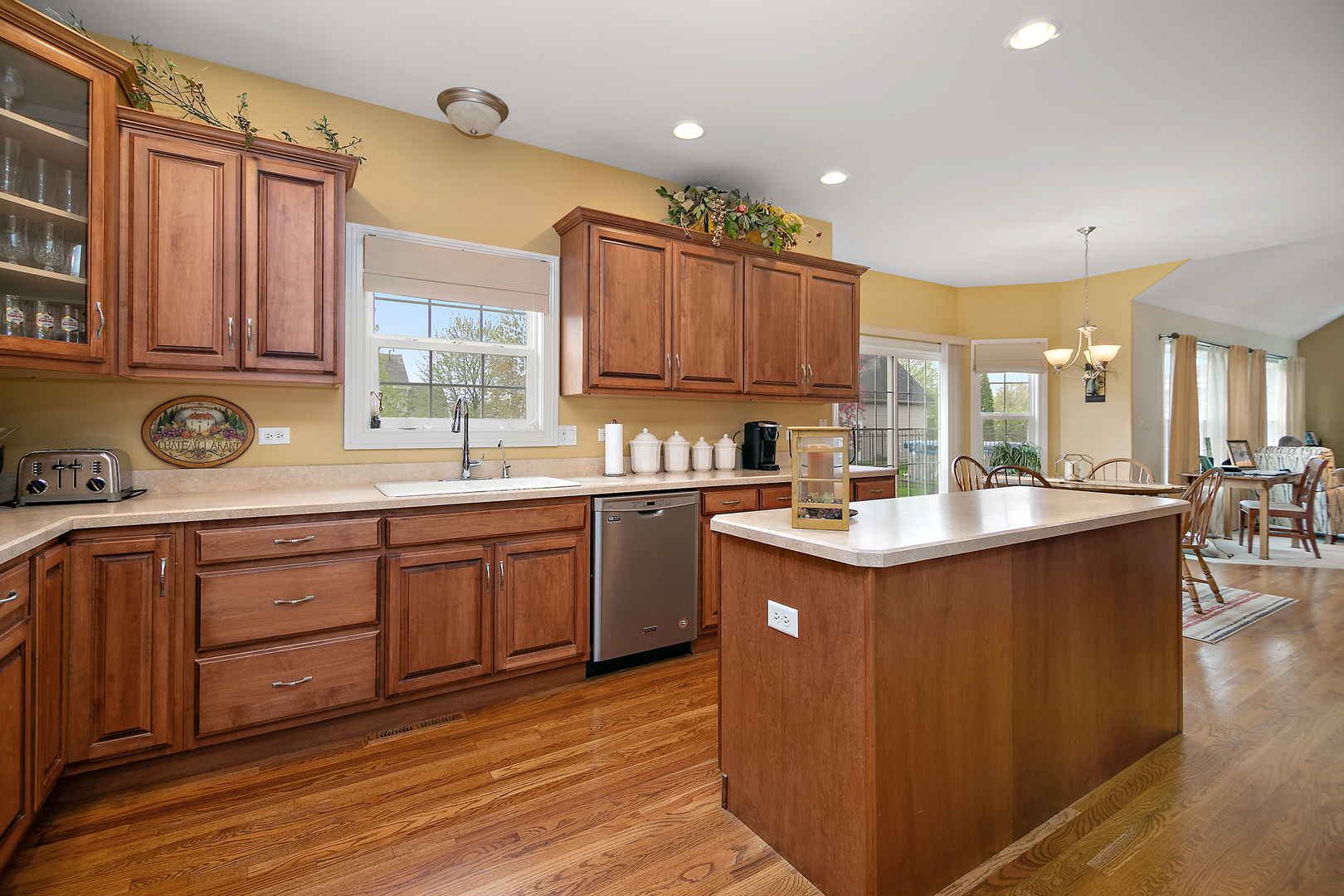 318 Maple Street Beecher, IL 60401 - Photo 9 of 27 a kitchen with a sink cabinets and window
