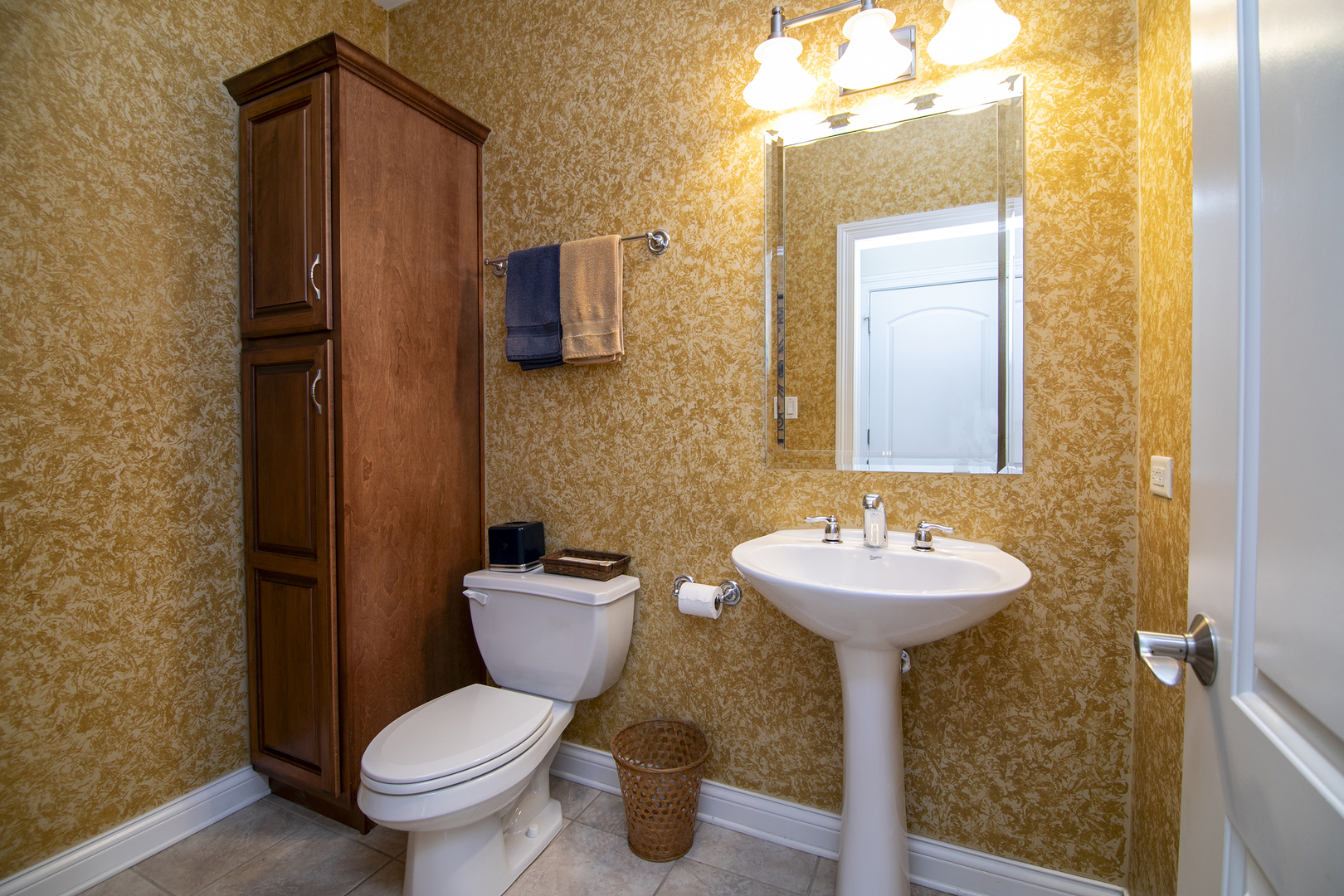 318 Maple Street Beecher, IL 60401 - Photo 10 of 27 a bathroom with a sink toilet and mirror