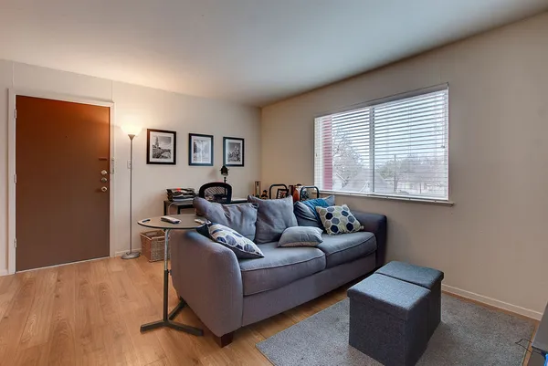 a living room with furniture and a window