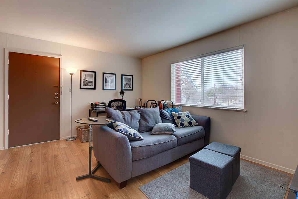 2207 Leon Street, Unit 107 Austin, TX 78705 - Photo 2 of 9 a living room with furniture and a window