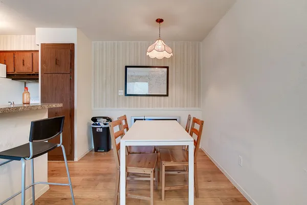 a view of a dining room with furniture and wooden floor