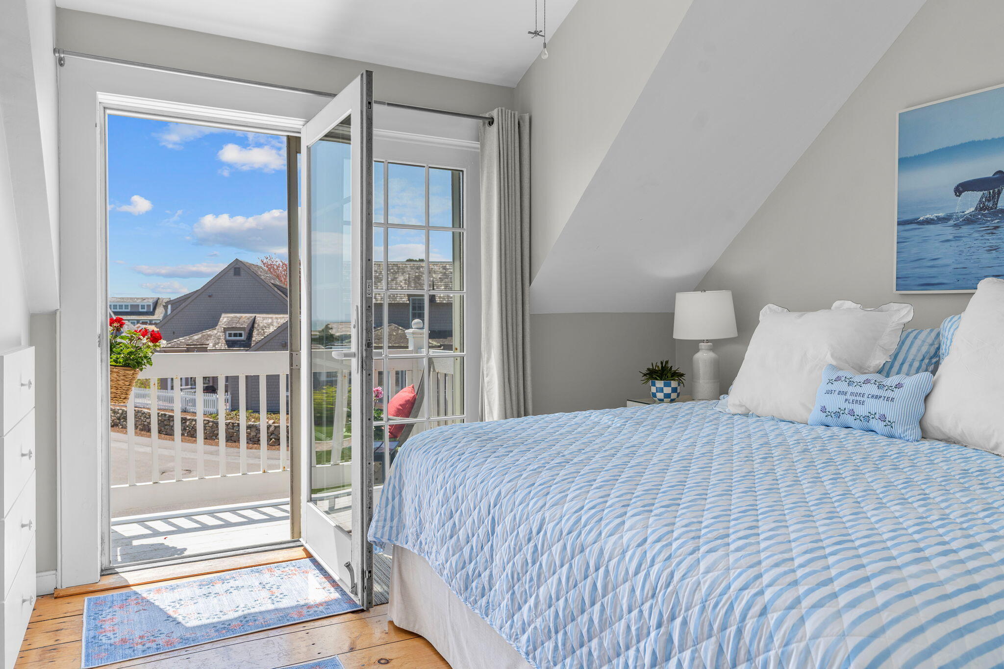 4 Race Point Road, Unit 4 Mashpee, MA 02649 - Photo 21 of 43 a bedroom with a bed and a large window with outer view