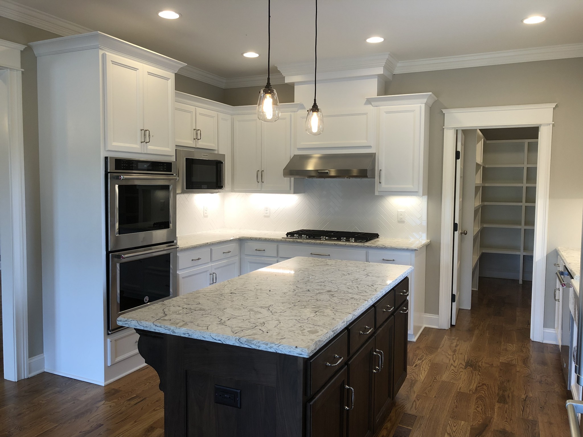 1333 County Line Road Watertown, TN 37184 - Photo 3 of 19 a kitchen with kitchen island a counter space a stove and a refrigerator