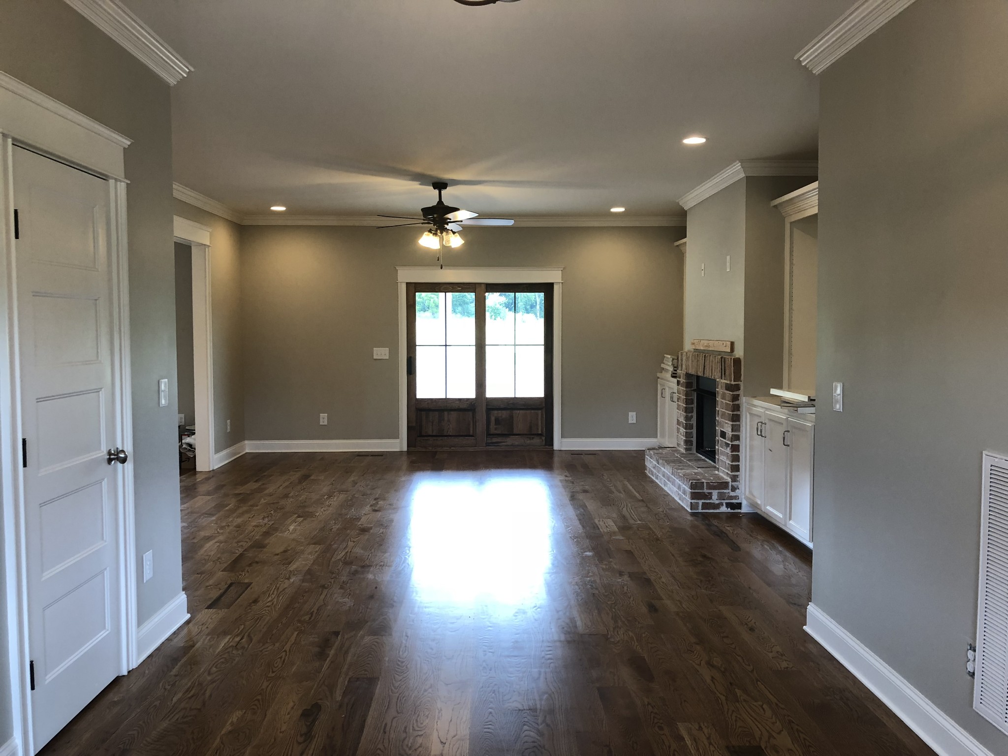 1333 County Line Road Watertown, TN 37184 - Photo 4 of 19 an empty room with wooden floor and windows