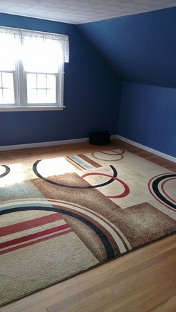 50 Greaney Street Springfield, MA 01104 - Photo 11 of 20 a bedroom with a bed and a window