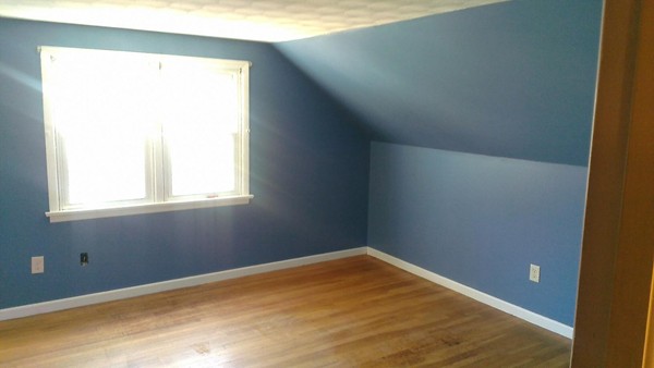 50 Greaney Street Springfield, MA 01104 - Photo 12 of 20 a view of a room with wooden floor and a window