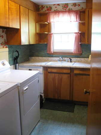 50 Greaney Street Springfield, MA 01104 - Photo 19 of 20 a kitchen with a sink cabinets and a window
