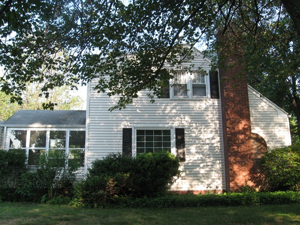 50 Greaney Street Springfield, MA 01104 - Photo 2 of 20 a front view of a house with a yard and garage