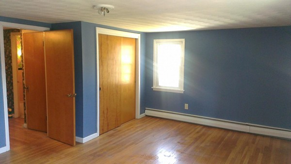 50 Greaney Street Springfield, MA 01104 - Photo 10 of 20 a view of an empty room with wooden floor and a window