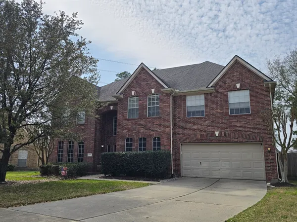 a view of staircase with white walls and windows