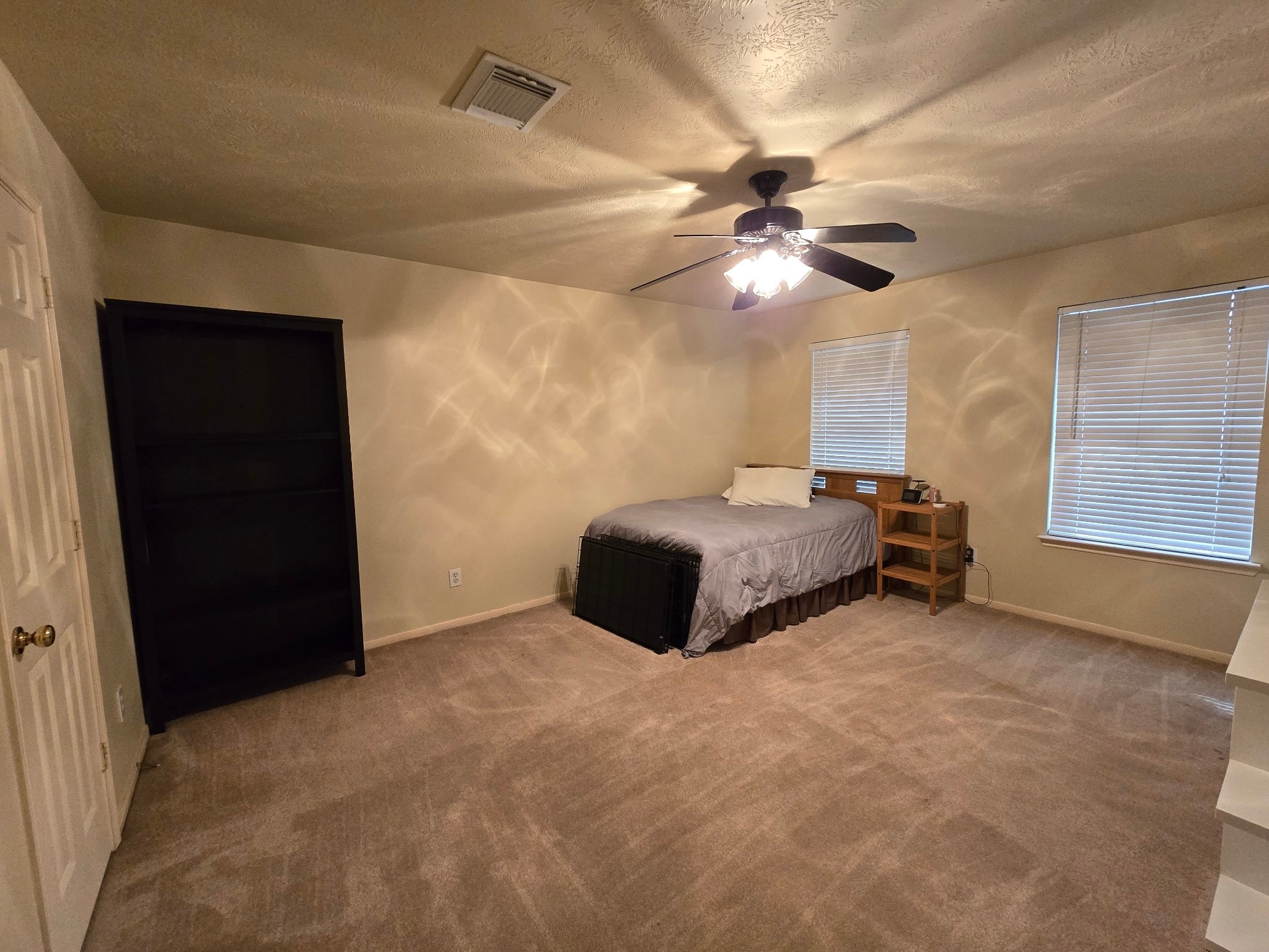 831 Hannock Glen Lane Spring, TX 77373 - Photo 21 of 26 a bedroom with a bed and a ceiling fan