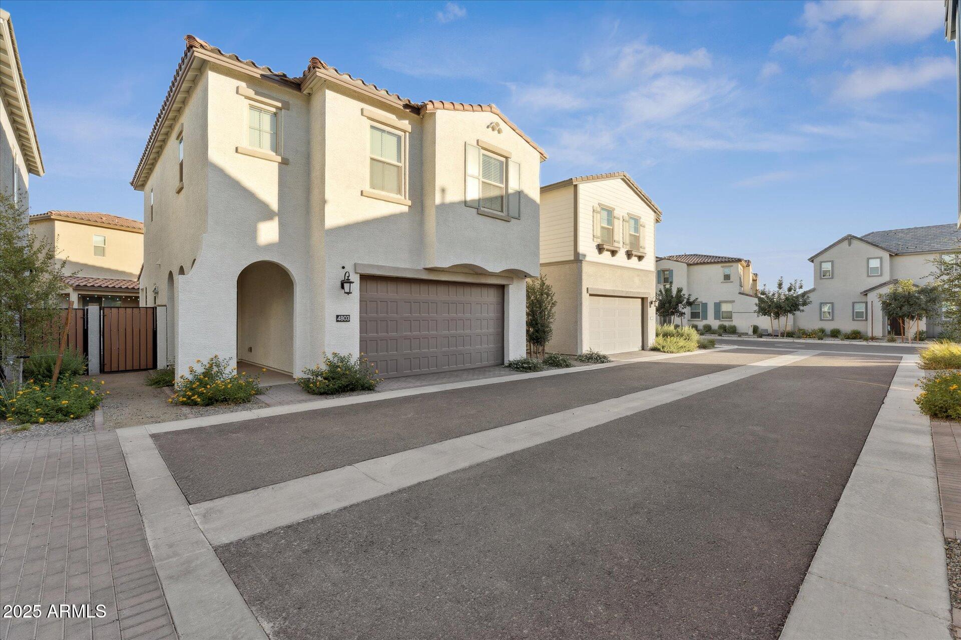 a front view of a building with a road