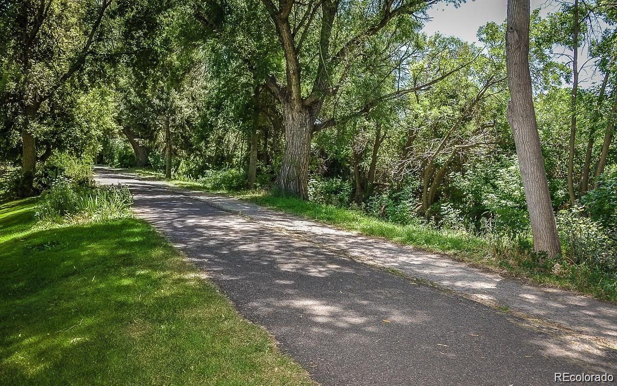 595 South Alton Way, Unit 7B Denver, CO 80247 - Photo 38 of 38 a view of a road with trees in the background