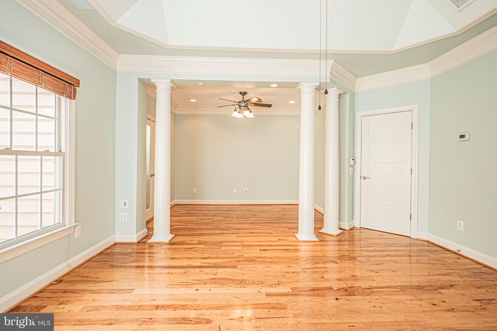 5448 Edsall Ridge Place Alexandria, VA 22312 - Photo 21 of 52 a view of a room with wooden floor and a window