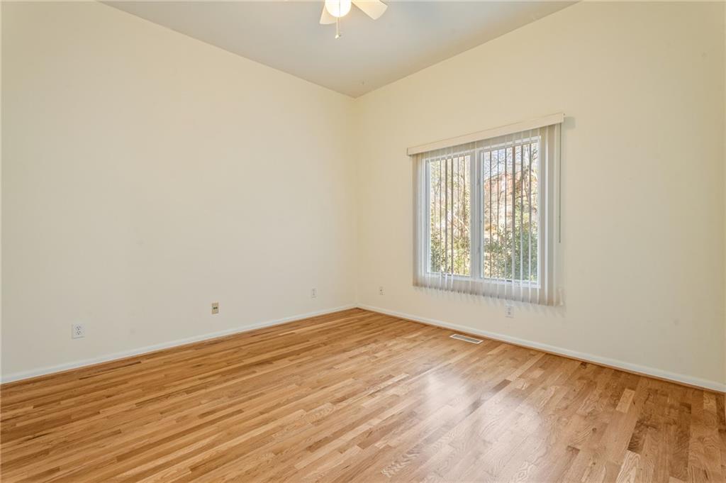 3010 Bluffton Way Roswell, GA 30075 - Photo 11 of 21 an empty room with wooden floor and windows