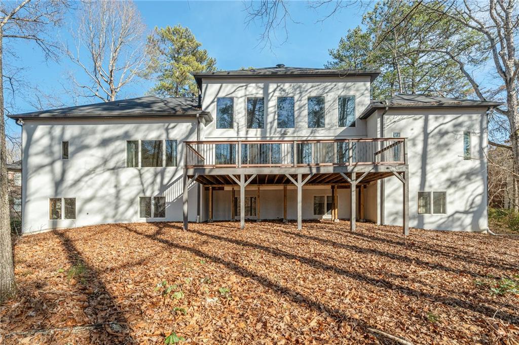 3010 Bluffton Way Roswell, GA 30075 - Photo 20 of 21 a view of a house with a wooden fence