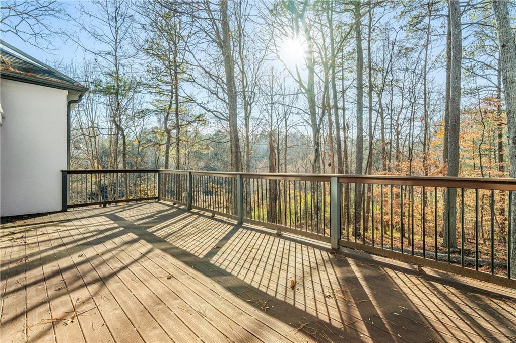 3010 Bluffton Way Roswell, GA 30075 - Photo 21 of 21 a view of a balcony with wooden floor and fence