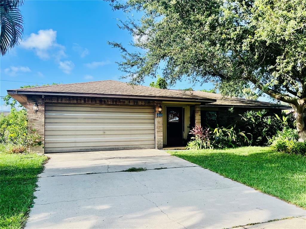 988 Elkcam Boulevard Cocoa, FL 32927 - Photo 1 of 8 a front view of house with a garden