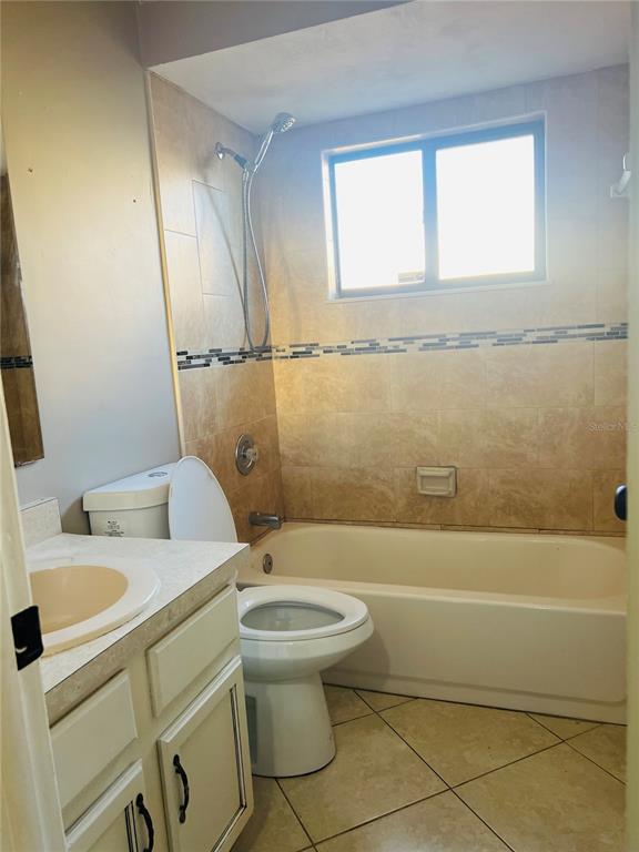 988 Elkcam Boulevard Cocoa, FL 32927 - Photo 2 of 8 a bathroom with a sink toilet and shower