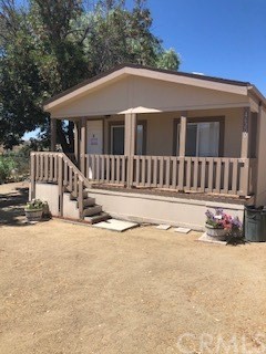 46200 Golden Stag Ranch Road Aguanga, CA 92536 - Photo 1 of 1 a front view of a house with a yard