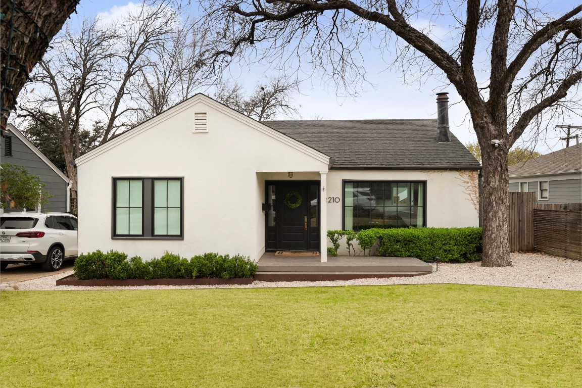 2210 Hartford Road Austin, TX 78703 - Photo 1 of 1 a view of a white house with a large pool and large trees