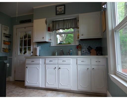 26 Glenwood Road Rutland, MA 01543 - Photo 15 of 29 a kitchen with stainless steel appliances granite countertop white cabinets and window