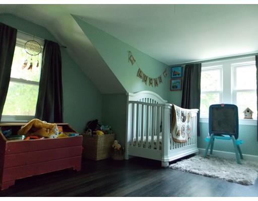26 Glenwood Road Rutland, MA 01543 - Photo 20 of 29 a bed sitting in a room next to a window