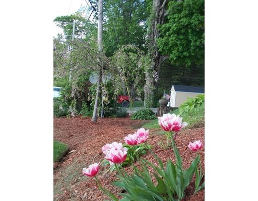 26 Glenwood Road Rutland, MA 01543 - Photo 4 of 29 a pink flowers in front of a house