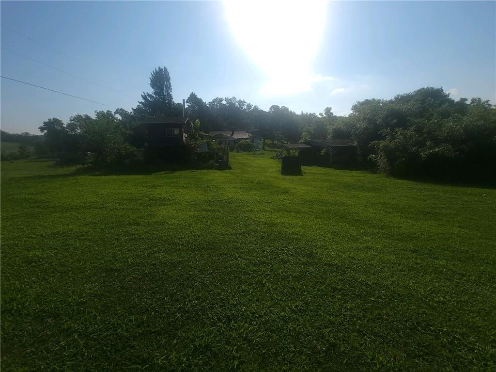 825 McClane Farm Road Washington, PA 15301 - Photo 3 of 26 a big yard with lots of green space and trampoline