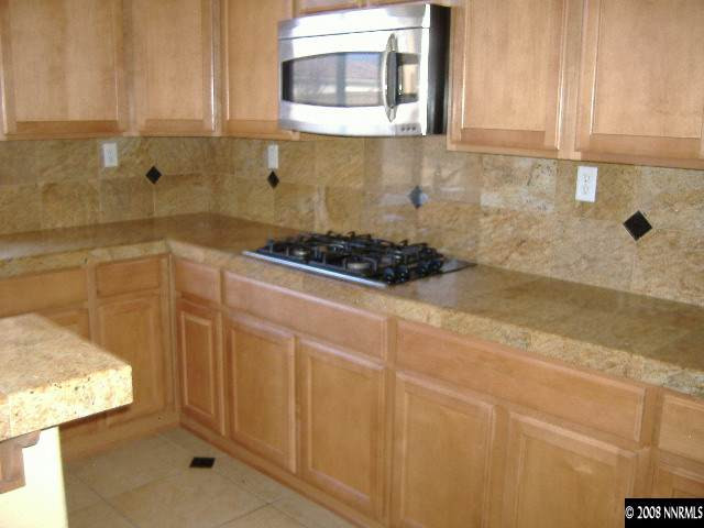 10664 Autumn Walk Lane Reno, NV 89521 - Photo 5 of 9 a kitchen with a sink and cabinets