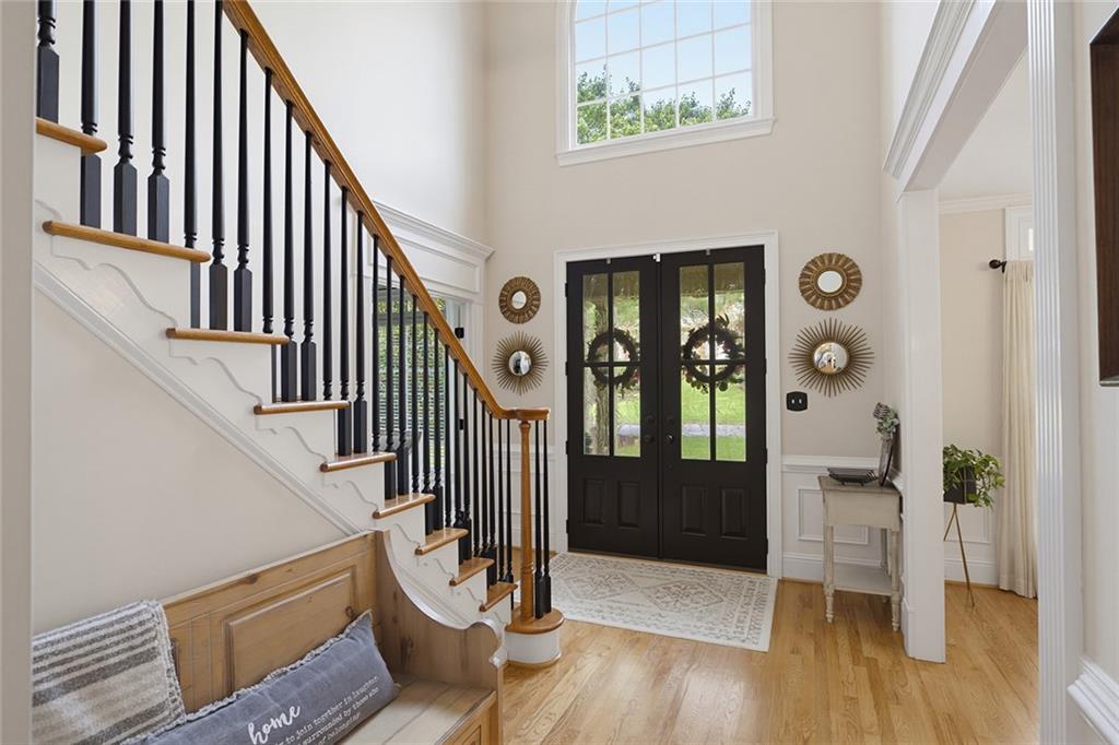 14442 Club Circle Milton, GA 30004 - Photo 4 of 82 a view of an entryway with wooden floor and door