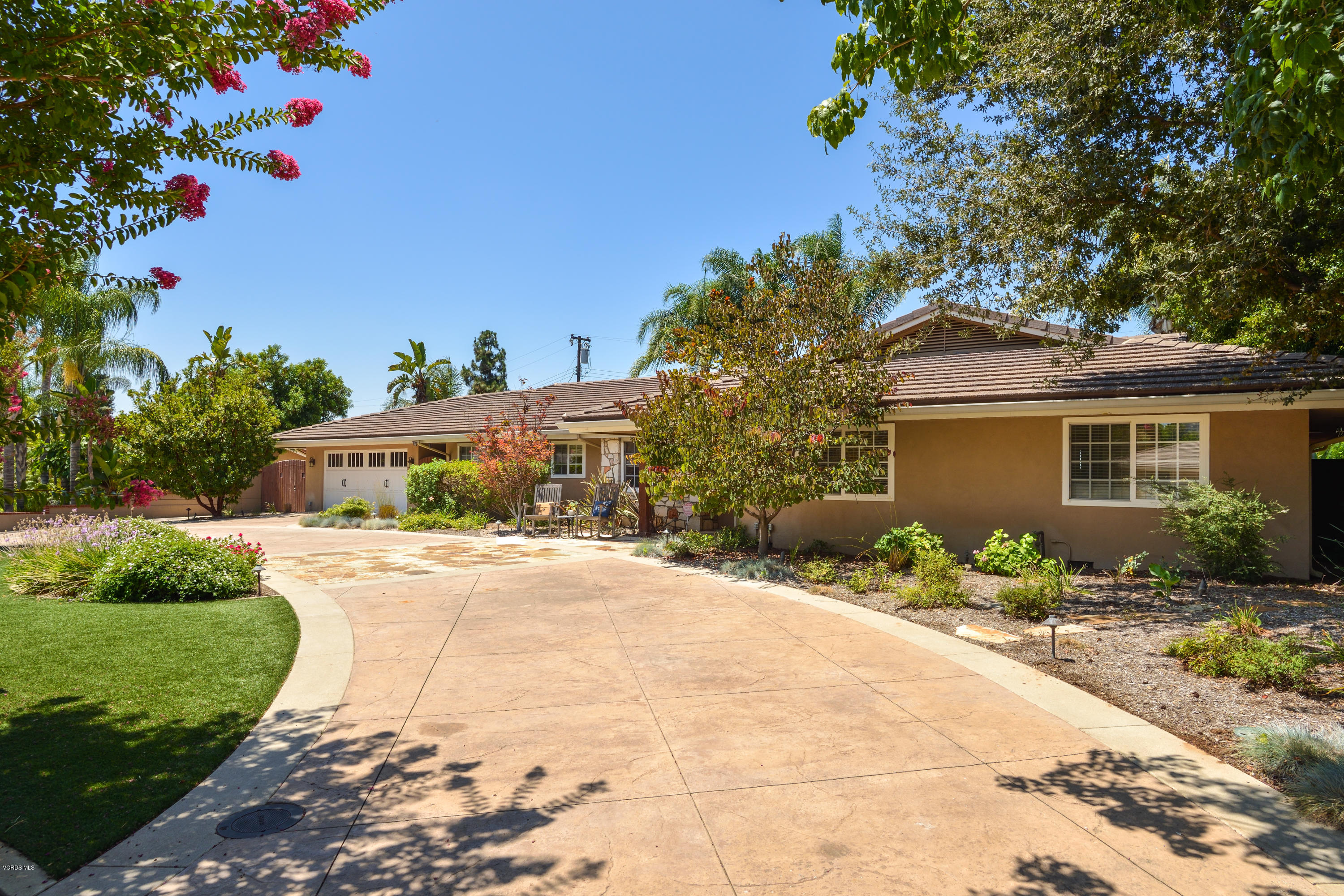 3327 Rancho Rio Bonita Road Covina, CA 91724 - Photo 1 of 58 a front view of a house with a yard and potted plants