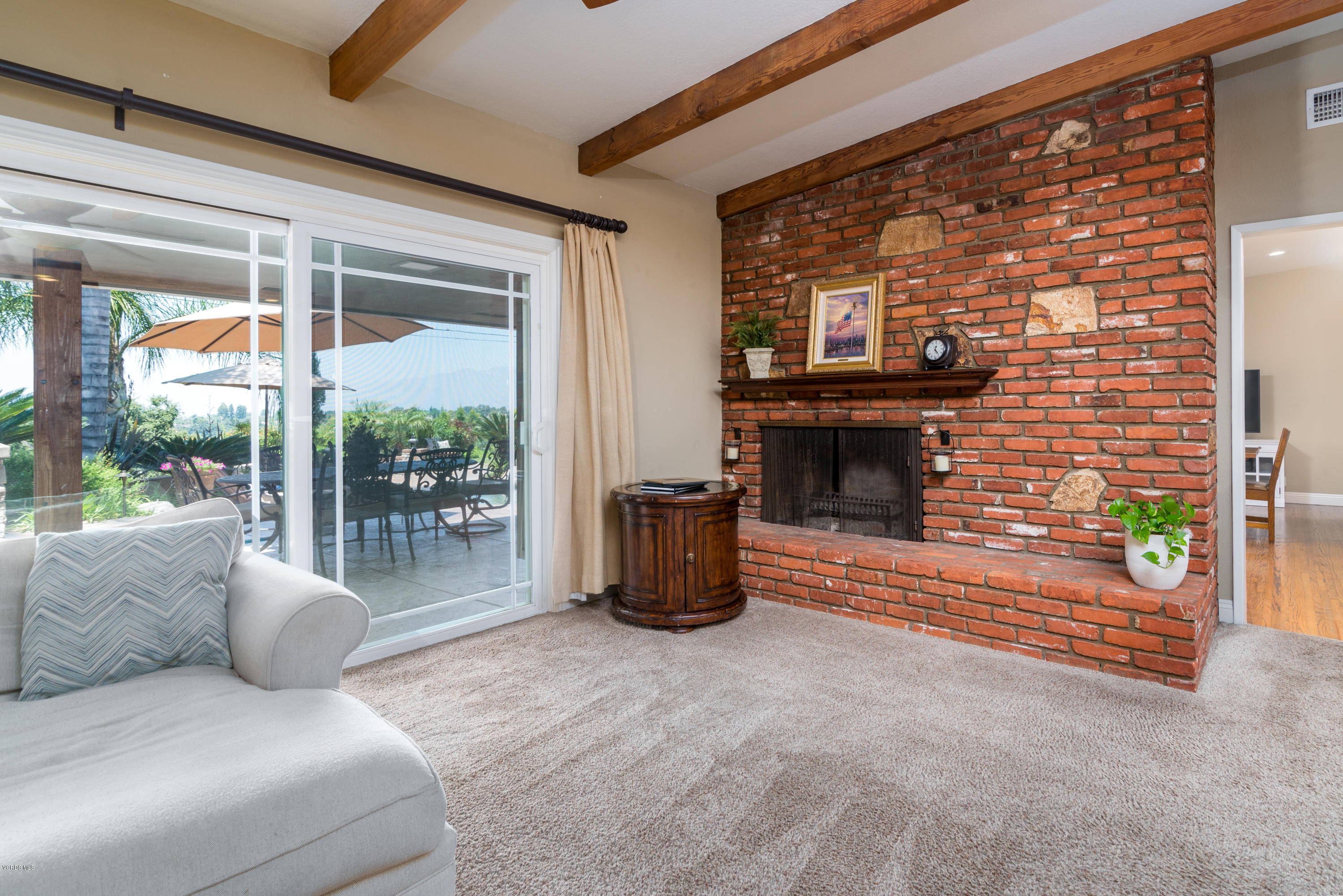 3327 Rancho Rio Bonita Road Covina, CA 91724 - Photo 12 of 58 a living room with furniture a flat screen tv and a fireplace