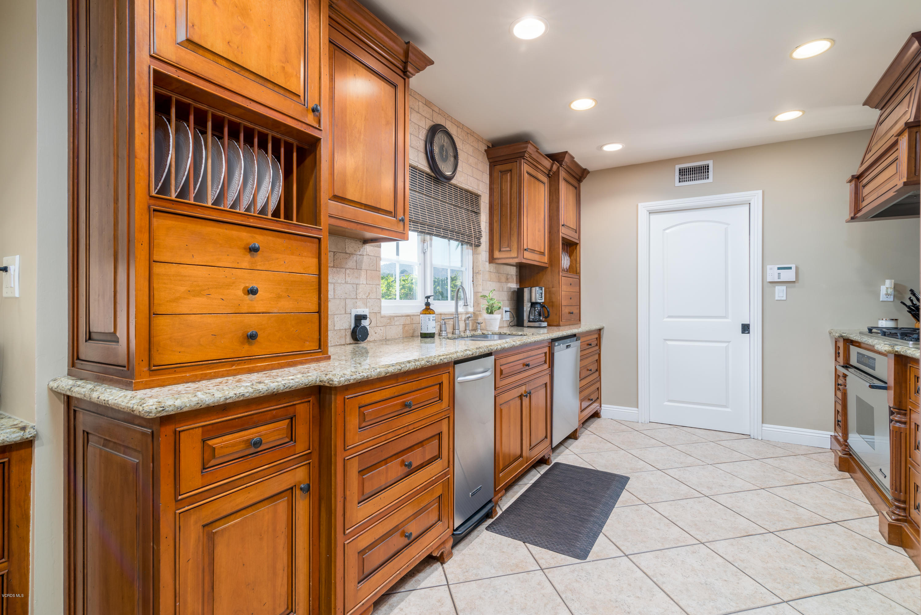3327 Rancho Rio Bonita Road Covina, CA 91724 - Photo 14 of 58 a kitchen with granite countertop cabinets and window