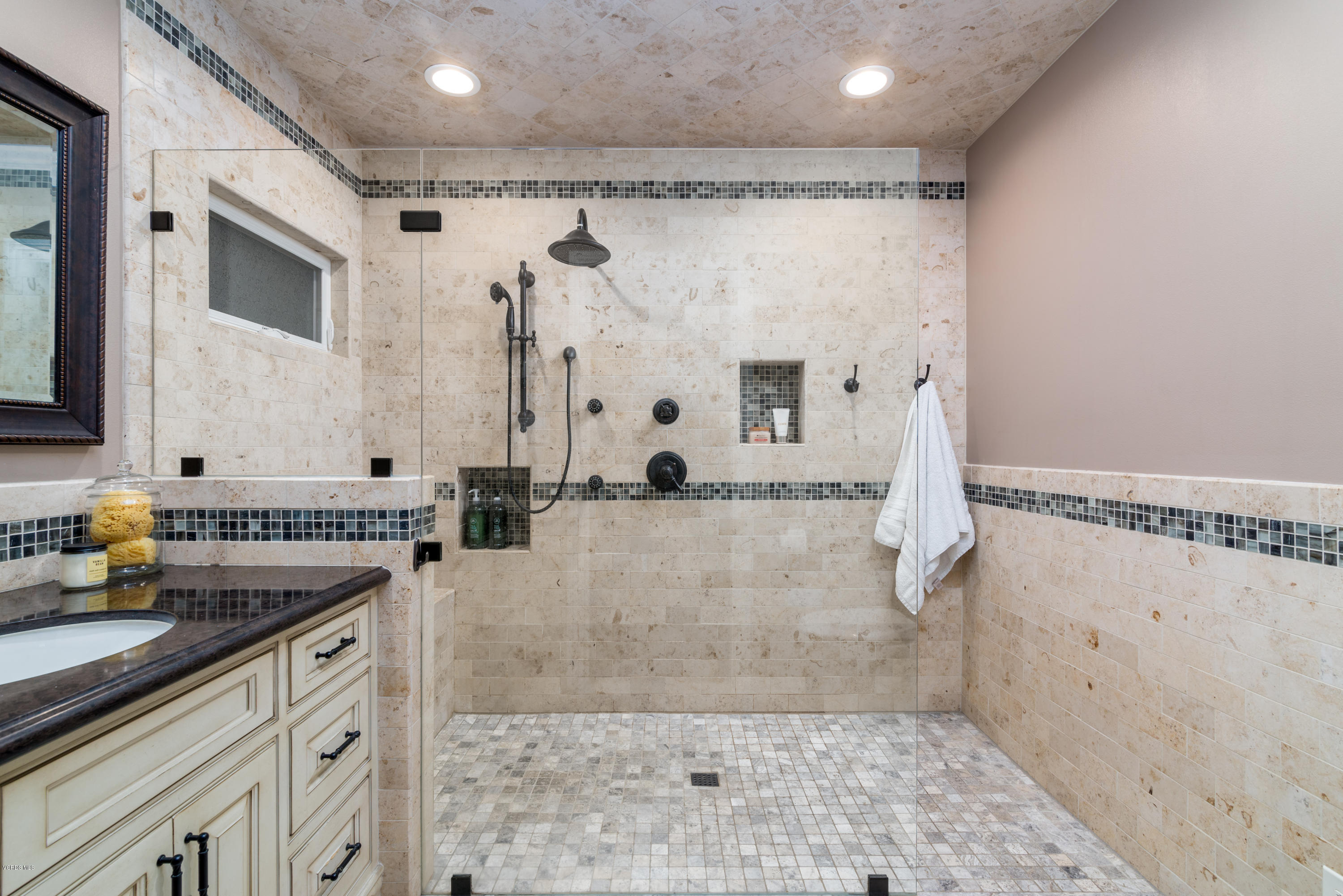 3327 Rancho Rio Bonita Road Covina, CA 91724 - Photo 25 of 58 a bathroom with a granite countertop sink a mirror a bathtub and shower