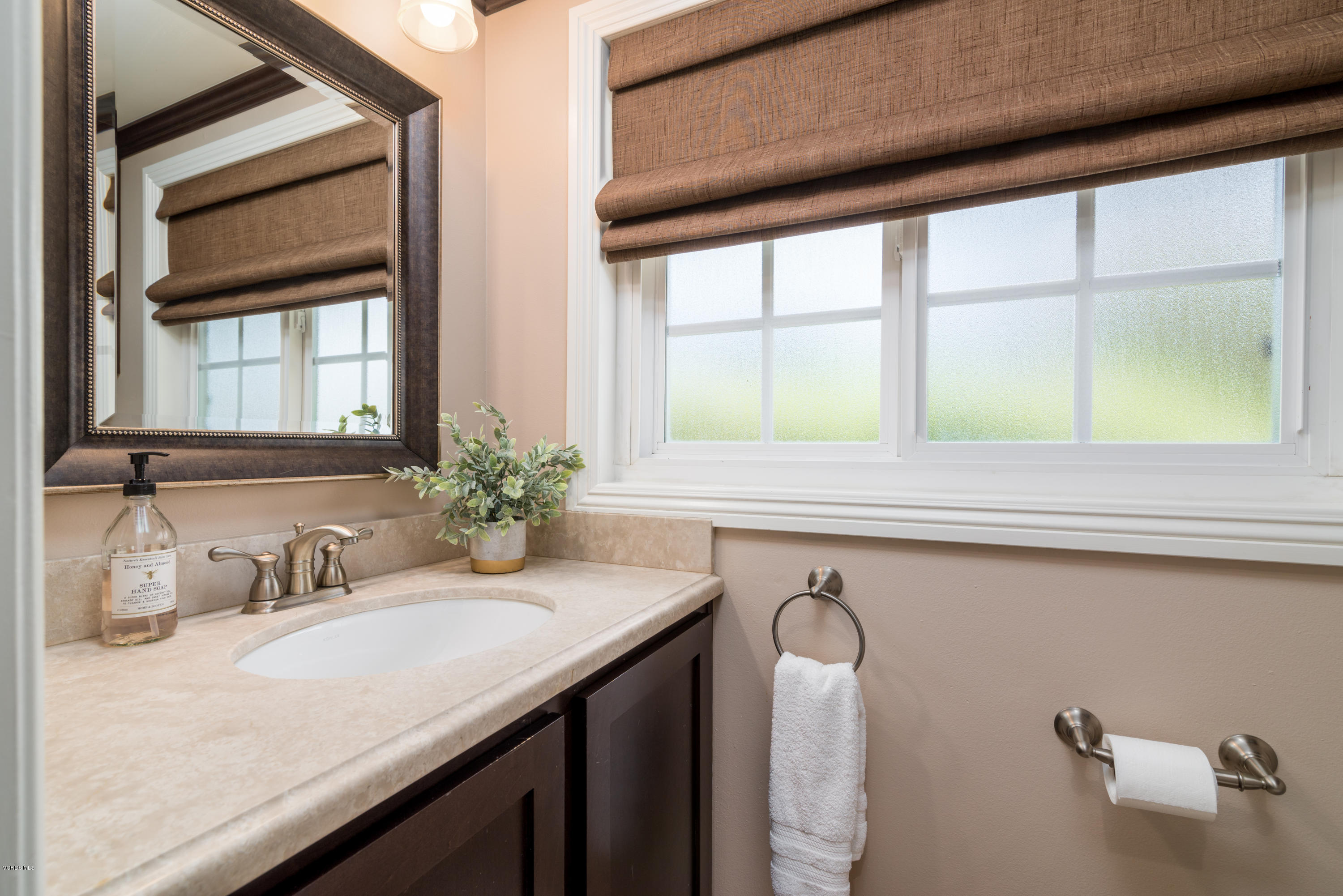 3327 Rancho Rio Bonita Road Covina, CA 91724 - Photo 33 of 58 a bathroom with a granite countertop sink and a window