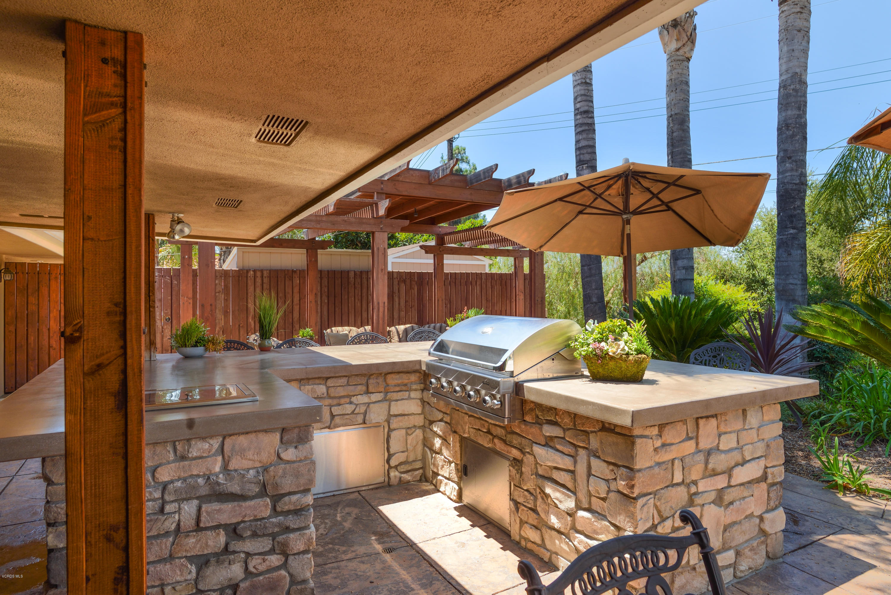 3327 Rancho Rio Bonita Road Covina, CA 91724 - Photo 44 of 58 a patio with a patio table and chairs
