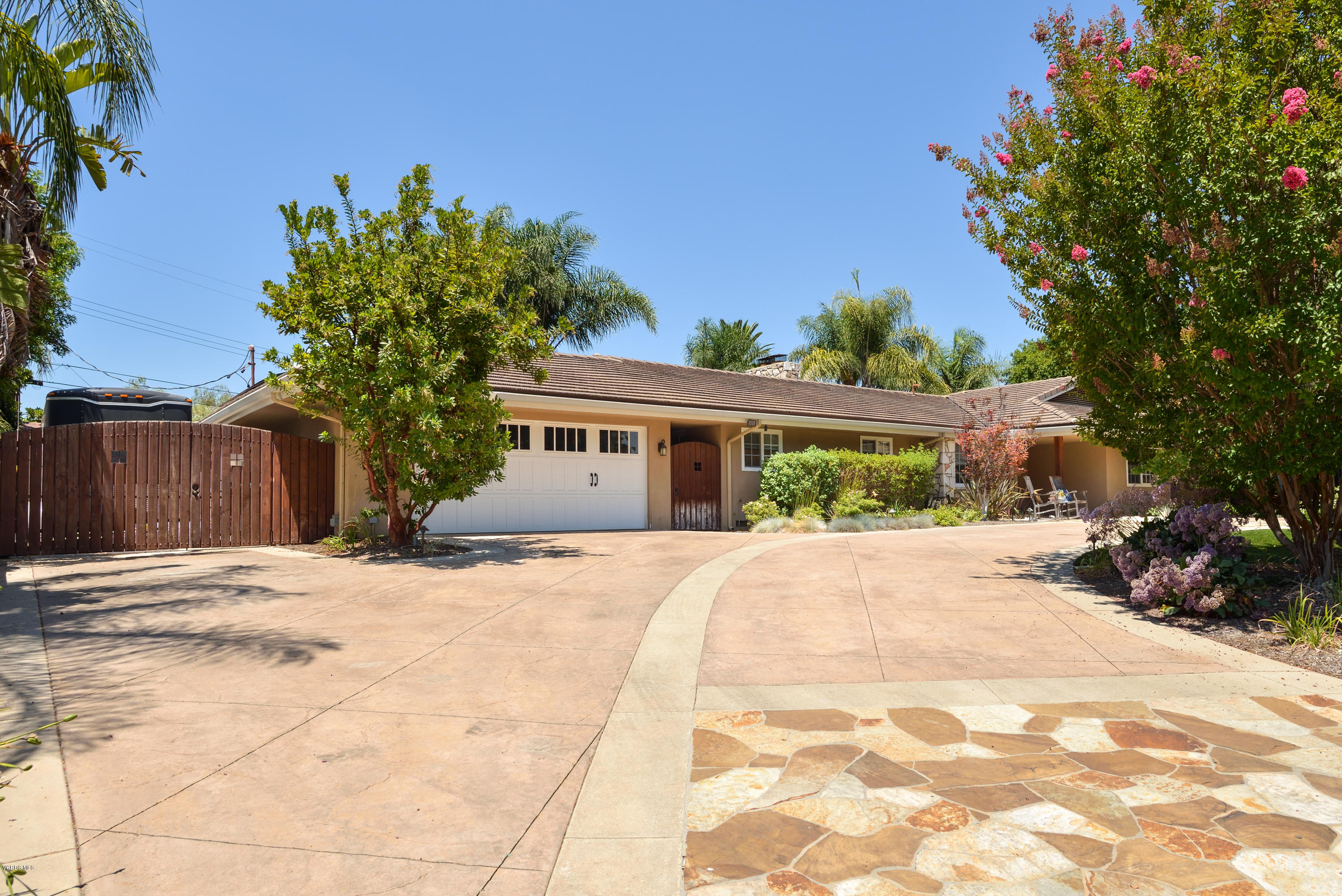 3327 Rancho Rio Bonita Road Covina, CA 91724 - Photo 5 of 58 a front view of a house with a yard and a garage