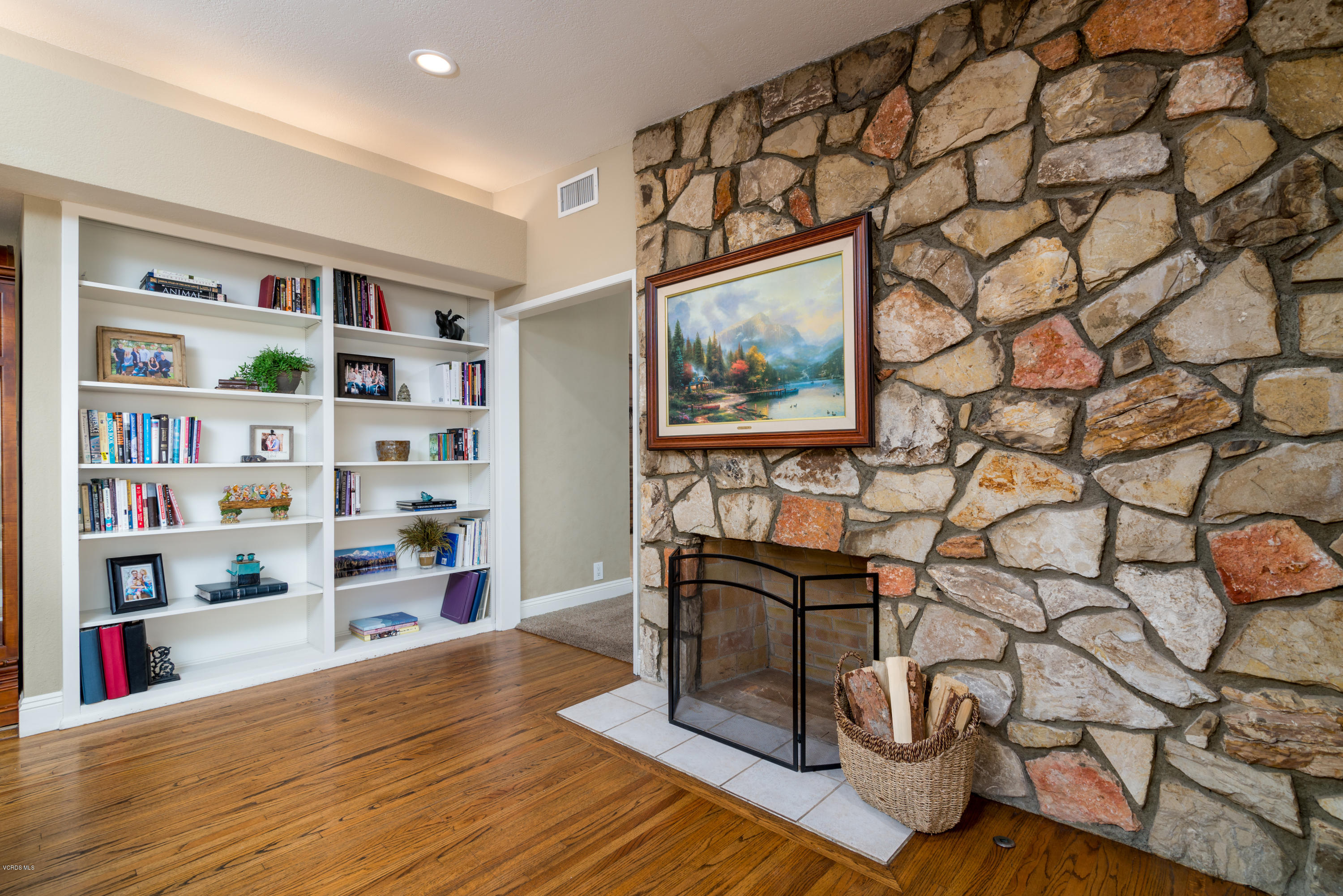 3327 Rancho Rio Bonita Road Covina, CA 91724 - Photo 10 of 58 a view of a workspace with furniture and book shelf