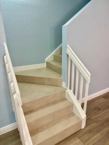 a view of staircase with white walls