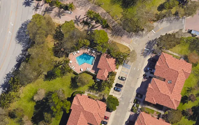 an aerial view of residential house with outdoor space and swimming pool
