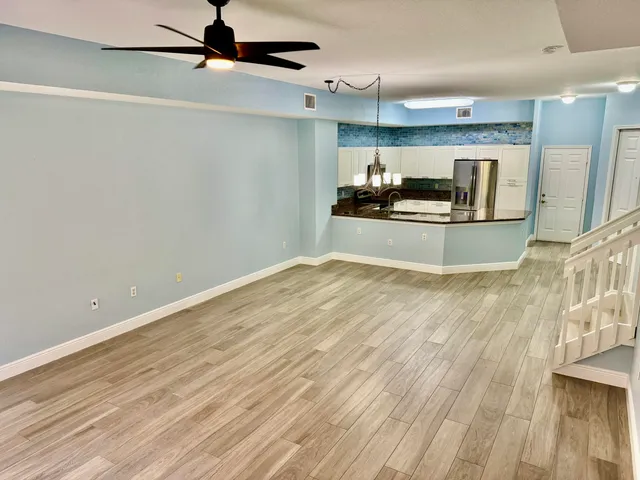a view of kitchen and wooden floor