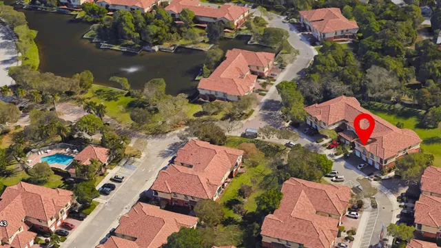 an aerial view of residential house with outdoor space and swimming pool