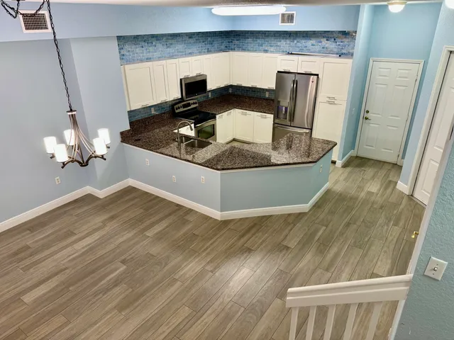 a living room with granite countertop furniture and a fireplace
