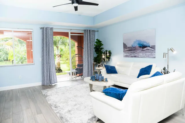 a living room with furniture and a large window